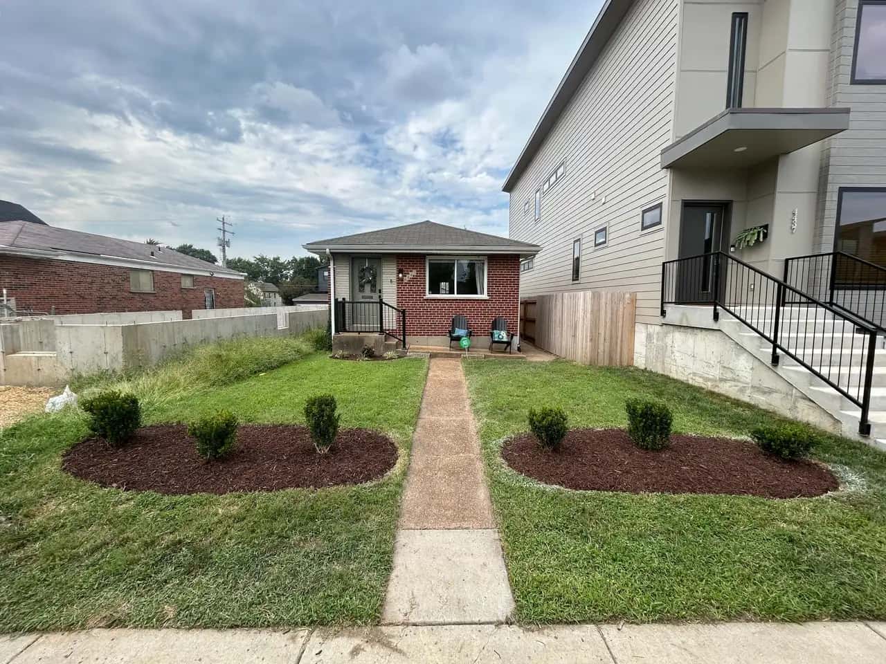 Front yard with mulched beds and a walkway
