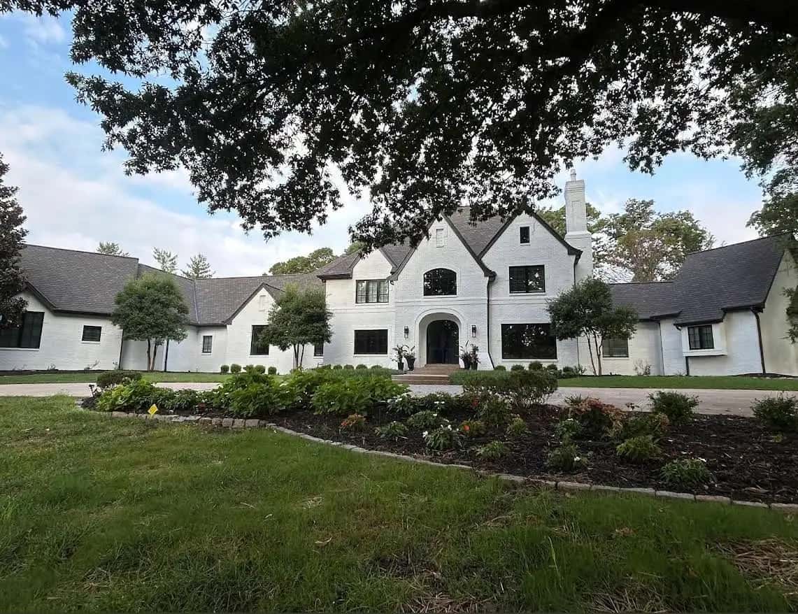Large home with a long garden bed and edging