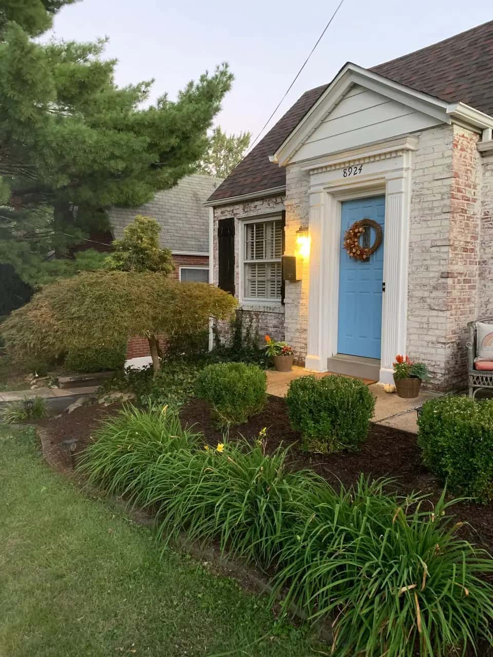 Front entry with shrubs, perennials and mulch